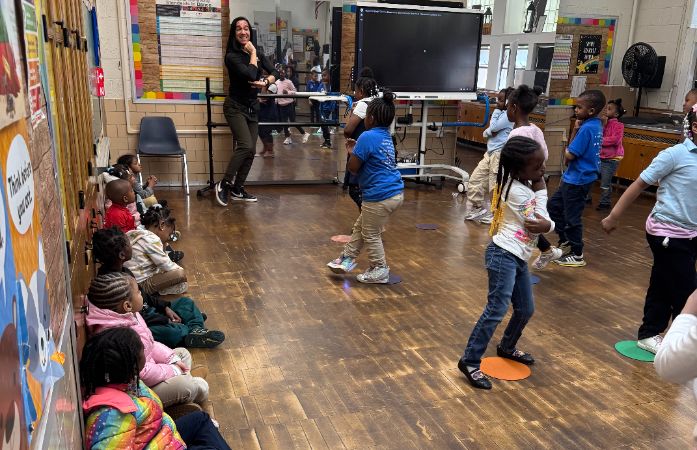  Pre- K Students coming to Dance Class for the first time. Students are seen sitting around the room